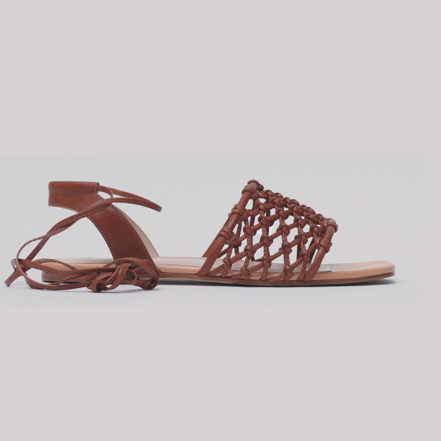 Flat sandal with ankle tie, tan and natural vachetta