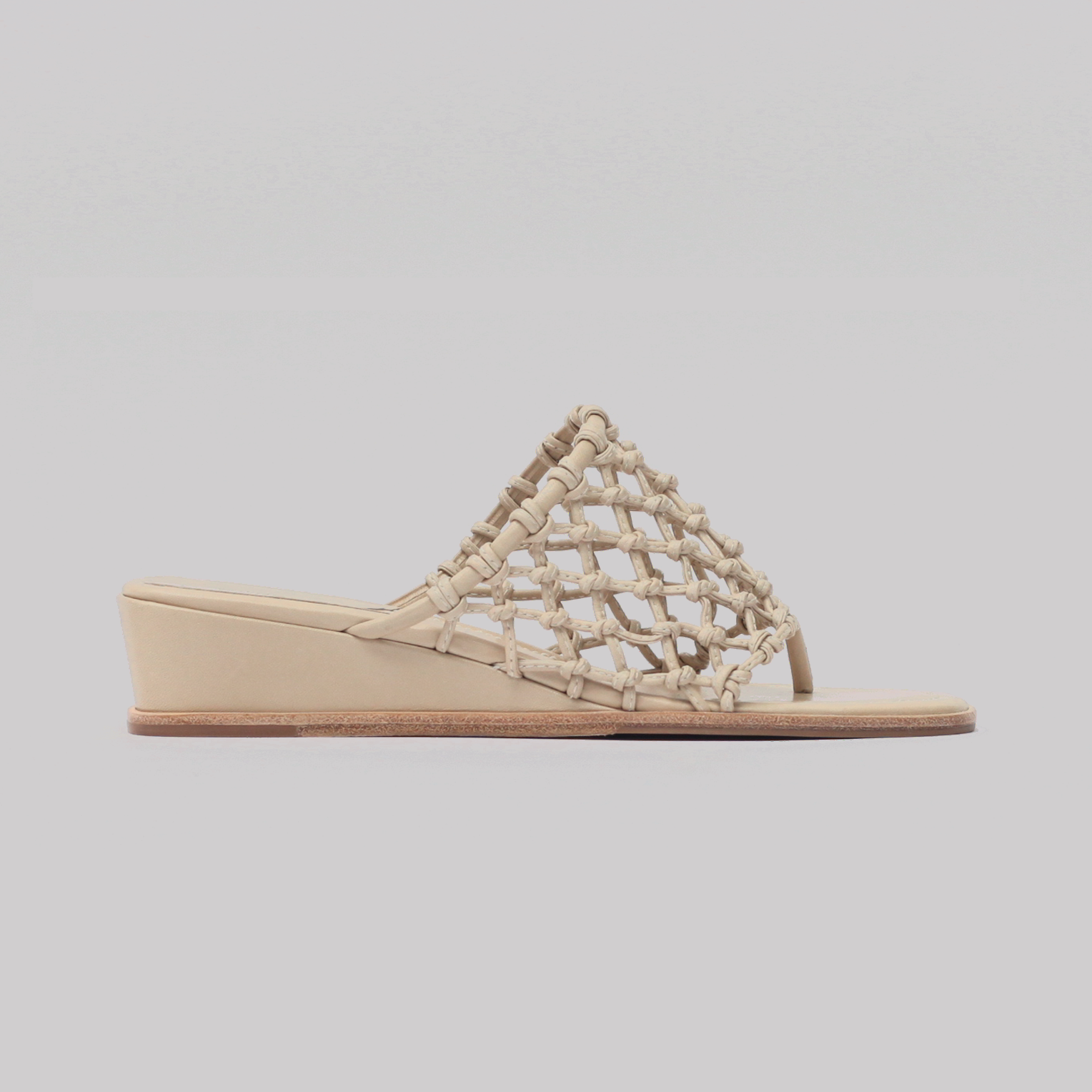 Mid-wedge knotted thong sandal, bone vachetta