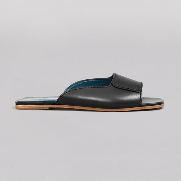 Wilder shoes - black women's flat slide sandal in black - maude - profile view